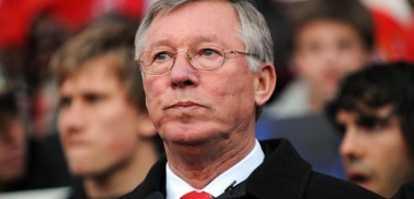 Sir Alex Ferguson watches on from the dugout